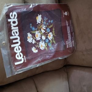 Crewel embroidery daisy craft pillow.